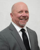 Official portrait of Dave Rustebakke